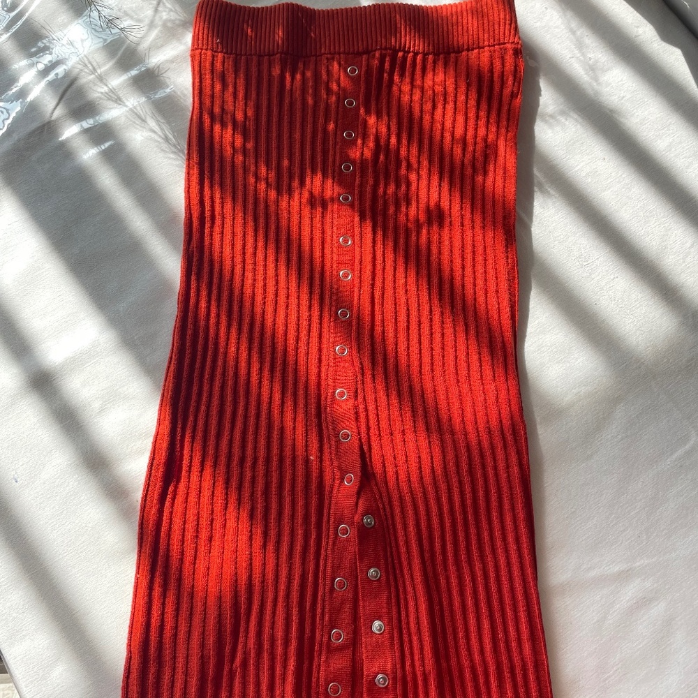 Long knit skirt with buttons.